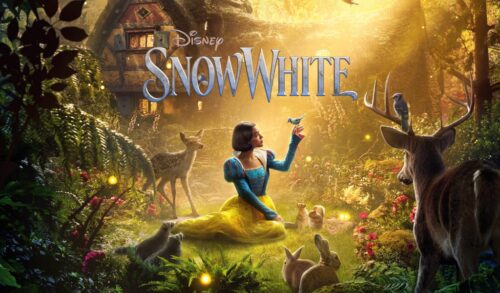 A woman dressed as a princess in a blue and yellow dress sits in a wooden area surrounded by woodland creatures There is a cabin in the background and the title reads Disneys Snow White